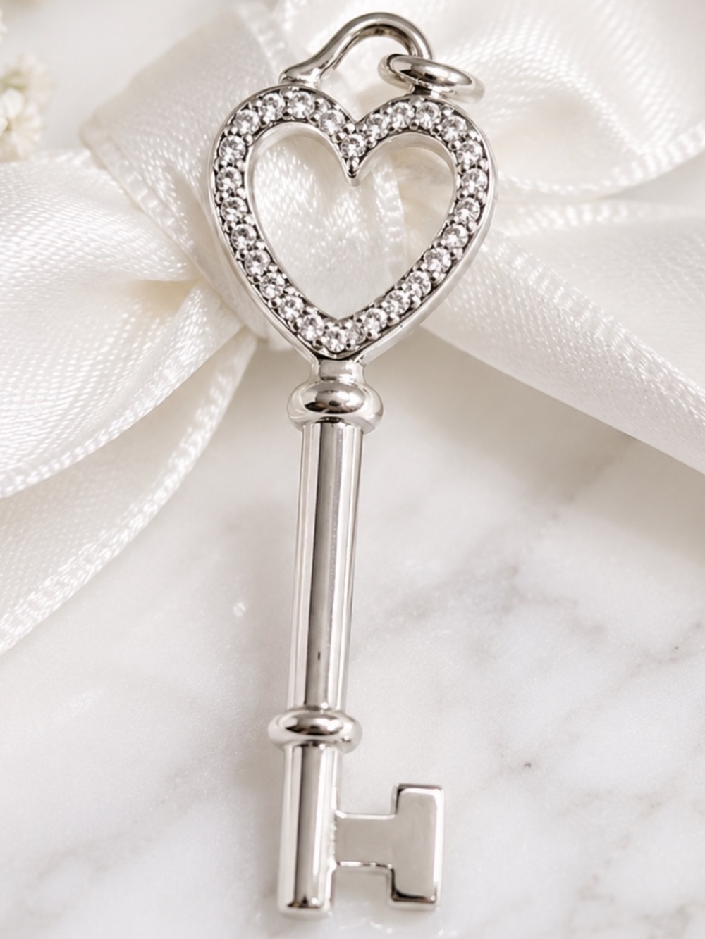 Tiffany & Co. Diamond Heart Key Charm 18kwg 1.5” – 0.10 CTW Diamonds
